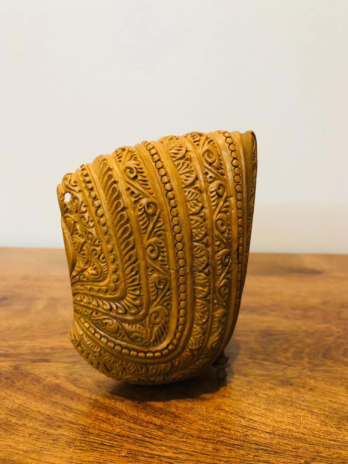 Sandalwood carved god inside shell - Malji Arts