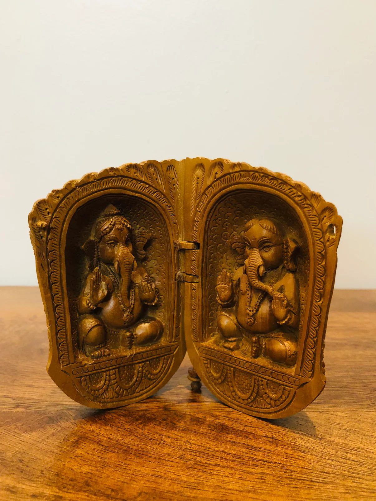 Sandalwood carved god inside shell - Malji Arts