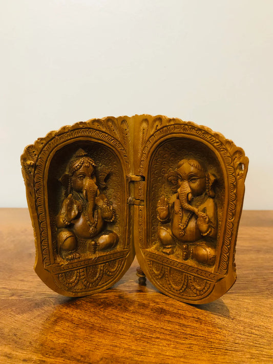 Sandalwood carved god inside shell - Malji Arts