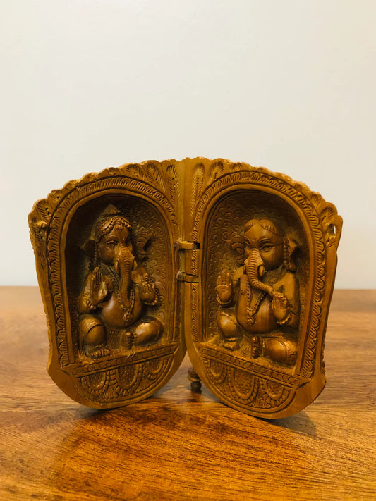 Sandalwood carved god inside shell - Malji Arts