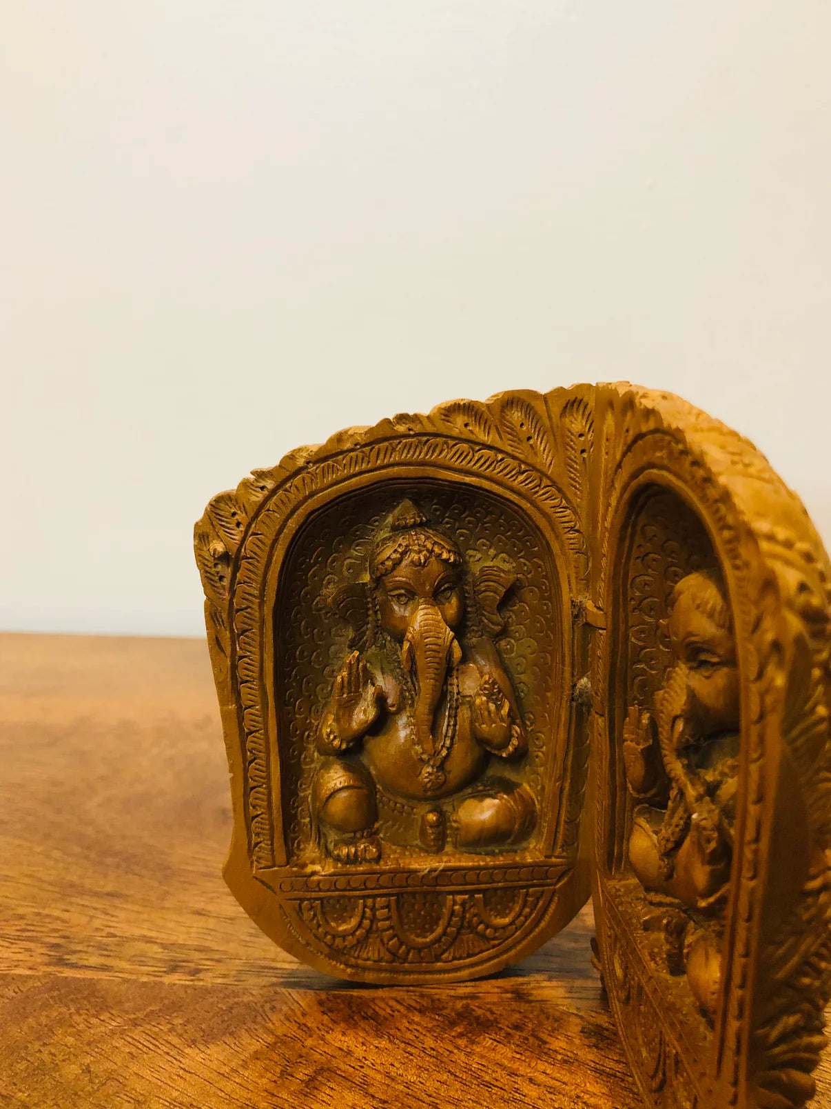 Sandalwood carved god inside shell - Malji Arts