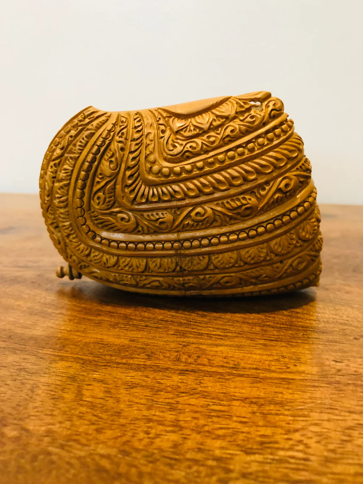 Sandalwood carved god inside shell - Malji Arts