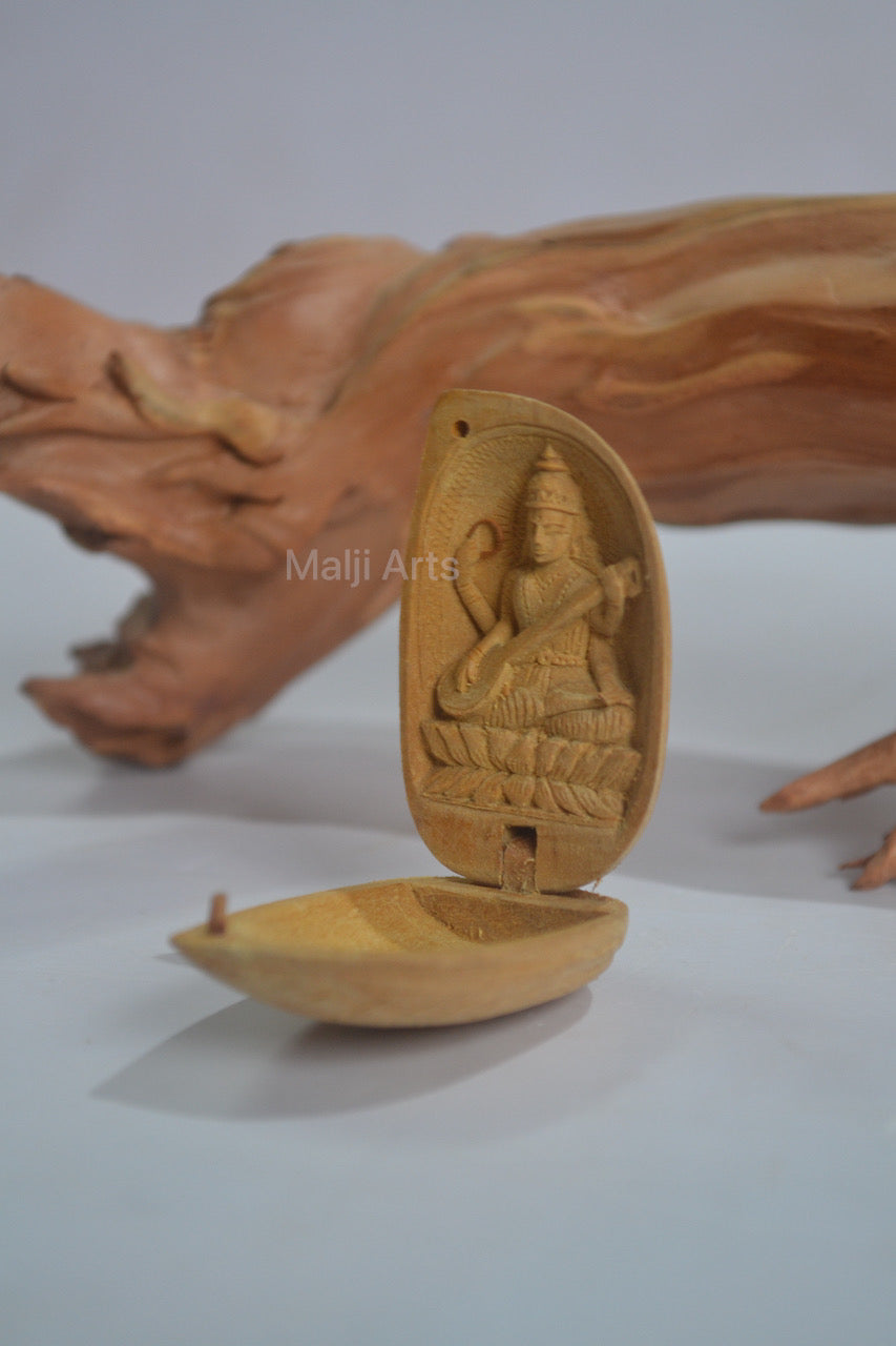 Sandalwood Miniature Saraswati In Almond - Malji Arts