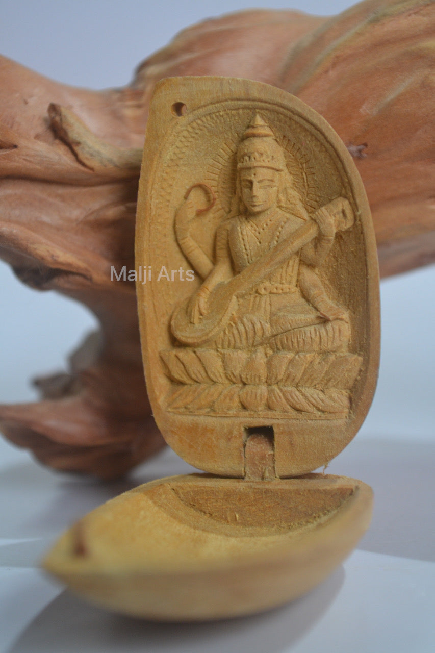 Sandalwood Miniature Saraswati In Almond - Malji Arts