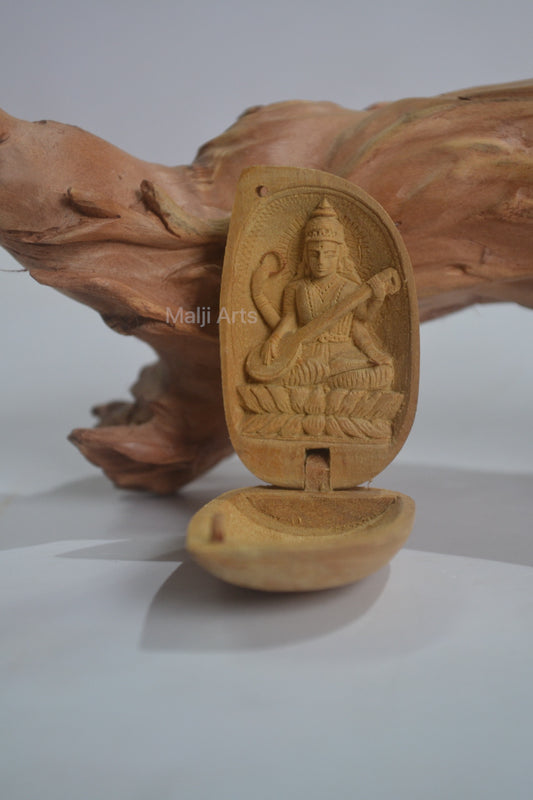 Sandalwood Miniature Saraswati In Almond - Malji Arts