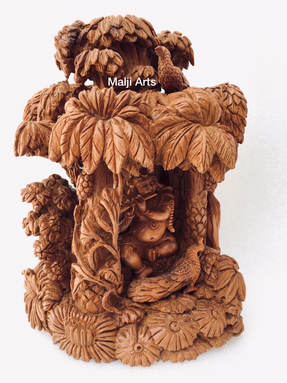 Sandalwood Baby krishna under tree playing flute - Malji Arts