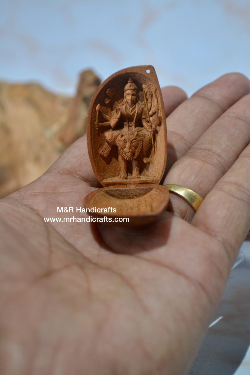 Sandalwood Carved Opening Almond Depicted Durga Statue Carved Inside - Malji Arts