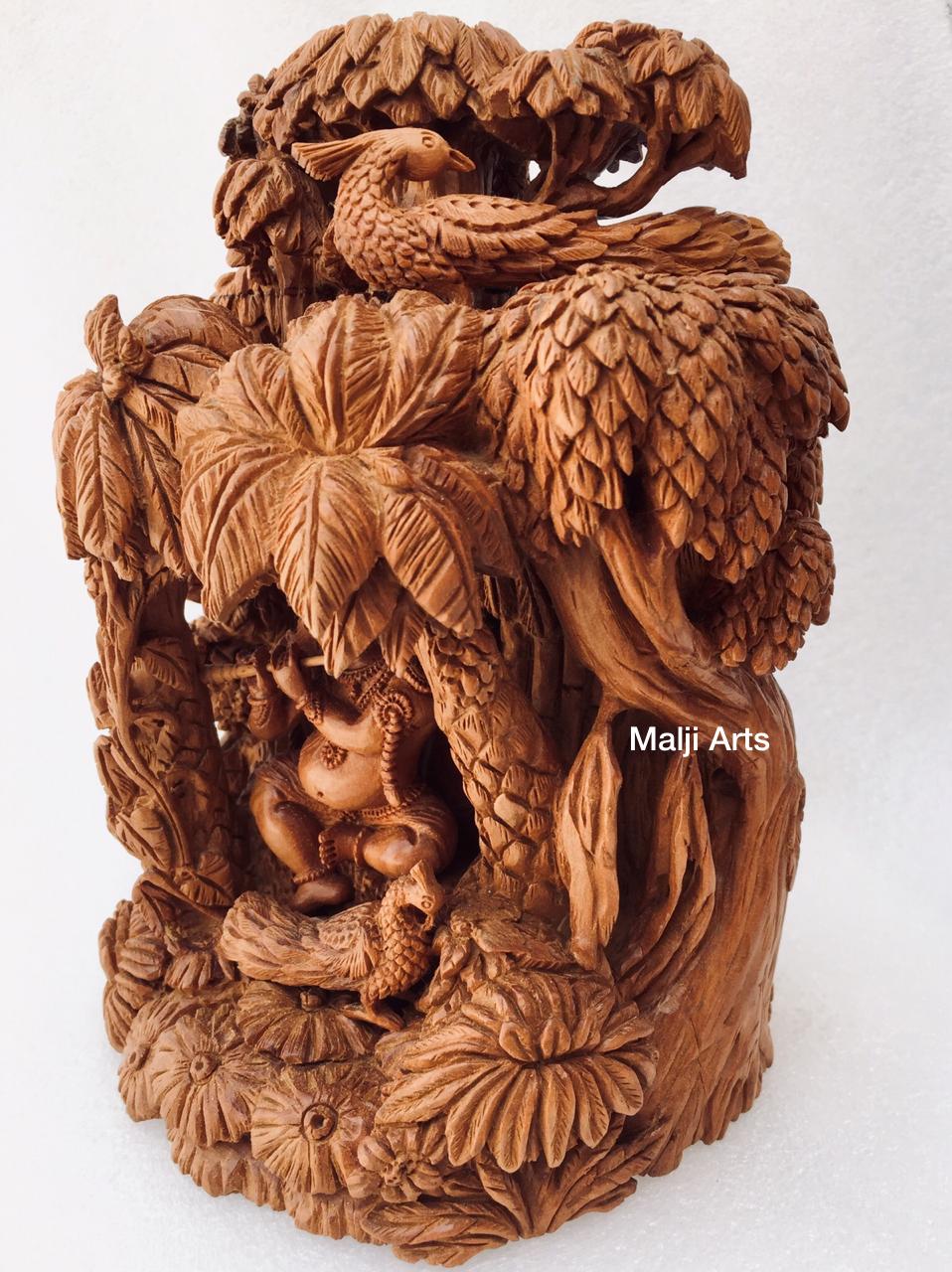 Sandalwood Baby krishna under tree playing flute - Malji Arts